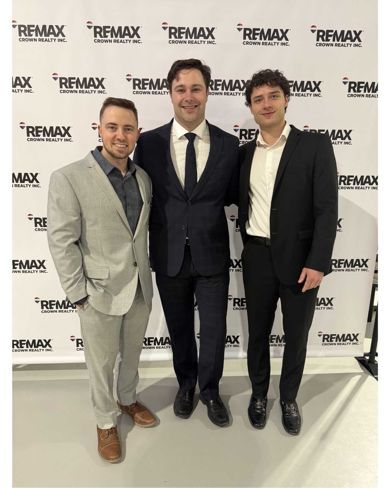 Team KING real estate agents Jason King, Shawn, and Aleks celebrating Titan Club milestone in Sudbury